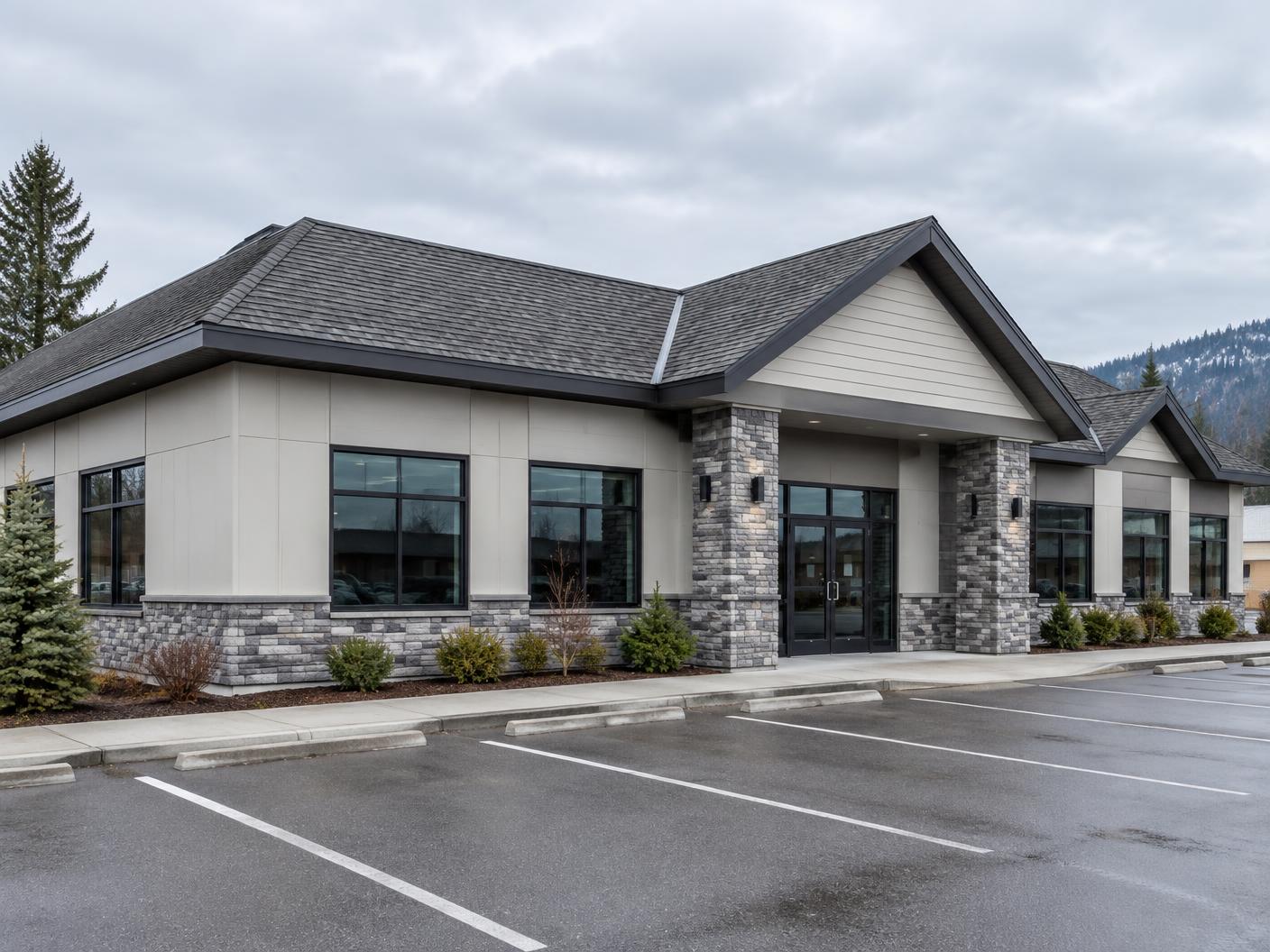 Low-rise Canadian commercial building with a sloped shingle roof