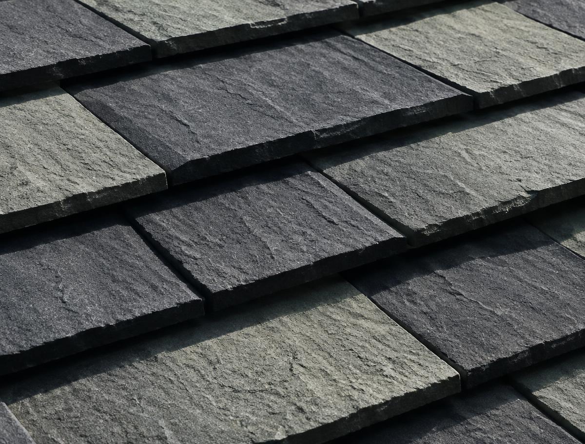 Close-up of premium slate-look designer roofing shingles with deep shadow bands